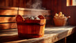 © Parol - Wooden sauna bucket filled with hot steaming rocks on bench in traditional sauna