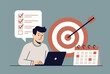 © Md - Young professional planning tasks and goals on a laptop with a large target and calendar for effective time management.