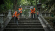 © bephoto - 朝の森の神社で石段と灯籠を点検する作業員