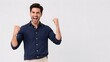 © 3AN - Excited screaming man celebrating success with raised fists in a navy blue shirt isolated on white background.