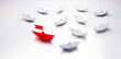 © peterschreiber.media - Group of  white paper boats with red leader in the middle on white background - 3D illustration