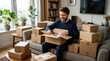 © DStocks - Man Opening Packages on a Couch Surrounded by Cardboard Boxes Featuring Happy, Smiling, Indoor with Living and Room Elements