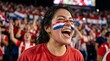 © Arpana - Cheerful female Croatia football fan with a painted flag on her cheek celebrating in a packed stadium.