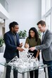 © AdPremium - Diverse Team of Architects and Engineers Collaborating on a Complex 3D Geometric Model in a Modern Office