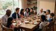 © Nadira - Diverse multi-generational family enjoying a delicious home cooked dinner meal together at home