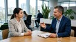© Supernova - Business professionals in modern office setting discussing career advancement and contract details during a one on one meeting