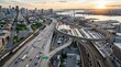 © Dara - A high-angle aerial photograph captures a sprawling cityscape at sunrise.