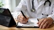 © Yang - Doctor writing prescription on clipboard, medical professional in white coat with stethoscope using pen for patient care and healthcare documentation