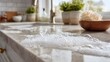 © HPMP Studio - Soapy foam cleaning solution on kitchen countertop.