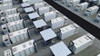 © Dark Artistic - Battery energy storage system container park with inverter stations and connecting cables, creating a modern infrastructure for sustainable power and green energy solutions on a large scale