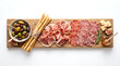 © Parvej - Artisanal charcuterie board display with cured meats, cheese, olives and bread on wooden platter