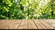 © Md Arif Babu - Rustic wooden table top with blurred green forest background, empty wood surface for product display, sunny outdoor garden park scene