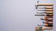 © Abdul - Assortment of carpentry tools on a light gray background with copy space
