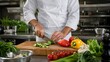 © Rifqi Zakiri - Professional chef slicing fresh vegetables on a wooden cutting board