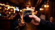 © Rahmat Chowdhury  57 - Hand holding a flaming cocktail drink in a dark bar with blurred background