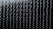 © ณภัทร วงค์มาวิวัฒน์ - Carbon Fiber Texture Close-Up: A detailed, abstract macro shot revealing the intricate woven pattern of carbon fiber, showcasing its strength and modern aesthetic.