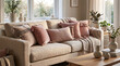 © Nimas - A cozy and inviting living room scene, featuring a plush sofa adorned with an assortment of textured throw pillows and blankets, bathed in soft natural light.