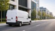 © Рудой Максим - White delivery van parked on a city street beside modern buildings during daylight hours