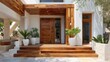 © COK House - A modern entrance features rich wooden decking and a massive door, set against a white stucco background with potted greenery.