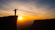 © SashaMagic - Silhouette of a person with arms outstretched on a cliff edge at sunset, embracing freedom and achievement.