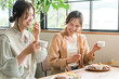 © buritora - Women enjoying a delicious lunch with their female friends/mom friends (girls' get-together)