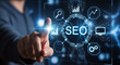 © Color Zen - Business person touching digital screen with search engine optimization seo interface icons and data growth charts