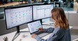 © Andrey Popov - Woman Using Laptop To Analyze Employee Data