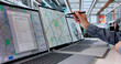 © Andrey Popov - Woman Urban Planner Analyzes City Land Maps On Laptop