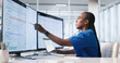 © Andrey Popov - Young Female Healthcare Worker Reviews Patient Records On Laptop