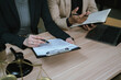 © Worawi - Close-up of a cash payment being handed over during a legal or business meeting, symbolizing financial transactions, settlement, agreement, bribery, corruption, or contract-related payment.