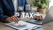 © Soyaeb - Professional accountant using laptop and calculator for tax preparation and financial management with digital icons