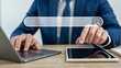 © Soyaeb - Businessman using laptop and tablet with virtual search bar on desk