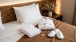 © Olga Ко - Lit d'hôtel confortable et accueillant avec un peignoir blanc, des chaussons, une serviette et une clé posés sur un plaid marron. Concept de voyage, de spa et d'hospitalité. IA générative.