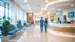 © Paras - blurred interior view of a modern hospital lobby with healthcare staff, reception desk, and empty patient waiting chairs.