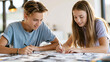 © CreativeArt - Teenagers drawing and sketching together in art class, students engaged in creative education and friendship