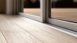 © Pixelzone - Stunning photo of close-up of a modern low-profile sliding glass door threshold track on a light oak wood floor leading to a terrace.
