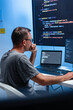 © SAT65 - Male Programmer Working on Coding Tasks for Software Development, Cloud Systems, and Data Center Technology, Focused on Screen While Developing Intelligent Software for LLM and Machine Learning.