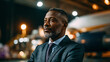 © CStock - Confident businessman standing in an airport, showcasing determination and professionalism in a corporate setting.