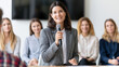 © Gold - Executive woman presenting annual achievements at a corporate press briefing , women speaking with reporter, business women, women sitting with reporters, a woman is presenting a p