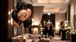 © Limbo - Black and rose gold balloons in a luxury hotel lobby for a party event