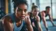 © Fahroni - A close-up of diverse athletes training together at a modern gym, showcasing body types, unity, and strength in motion, reflecting inclusion, empowerment, and shared determination in fitness culture