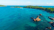 © CravenA - Aerial view of beautiful landscape, tourism boats, and people swimming on the sea and beach on Gam Ghi island in Phu Quoc, Kien Giang province, Vietnam