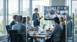 © David Zarzosa - Business team in modern conference room attending hybrid meeting with remote colleagues on video screen.