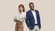 © SHUMAYA - Professional man and woman standing with confident poses