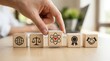© Sukon - Core business values and strategy principles represented by wooden cubes on a flat surface.