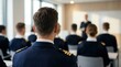 © Pinit - Structured training session in a classroom featuring uniformed trainees facing a male instructor.