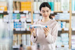 © JackF - Girl in autumn clothes buys medicinal ointment or gel at a pharmacy