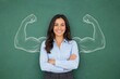 © FoxGrafy - Confident businesswoman flexing metaphorical strength on a green chalkboard background