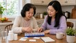 © gn8 - Medication Adherence Chinese Older Woman Her Daughter Caregiver