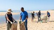 © Penak - People cleaning beach environment collecting trash plastic waste for conservation